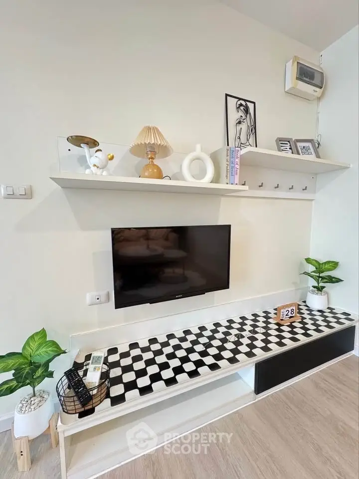 Stylish living room with modern decor and wall-mounted TV