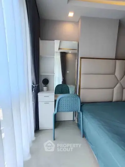 Modern bedroom with stylish decor and natural light