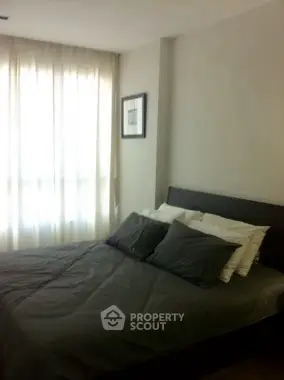 Cozy bedroom with soft lighting and modern decor, perfect for relaxation.