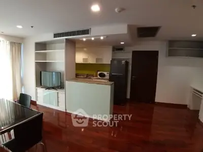 Modern open-layout kitchen with sleek appliances and hardwood floors