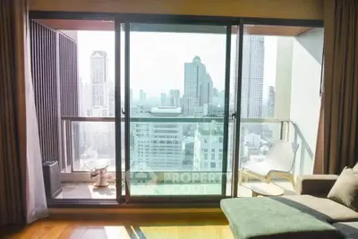 Luxurious high-rise apartment with stunning city view from spacious balcony.