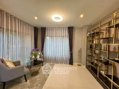 Elegant living room with modern decor and large windows