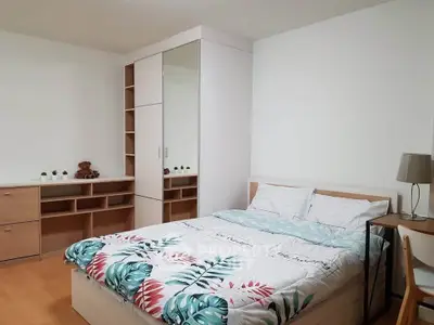 Spacious bedroom with modern furniture and stylish decor