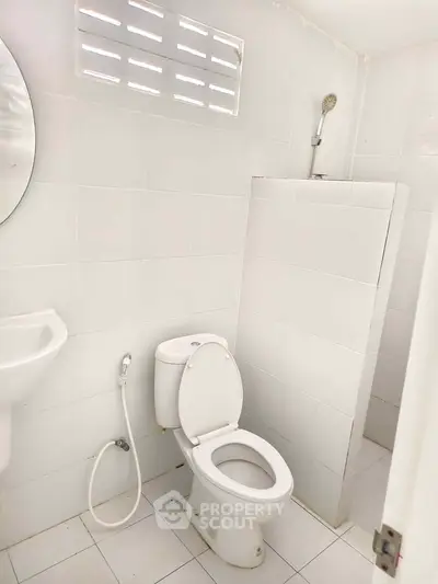 Bright and clean bathroom with modern fixtures and white tiles