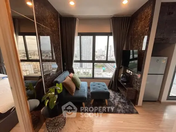 Modern living room with city view, stylish decor, and cozy seating area.