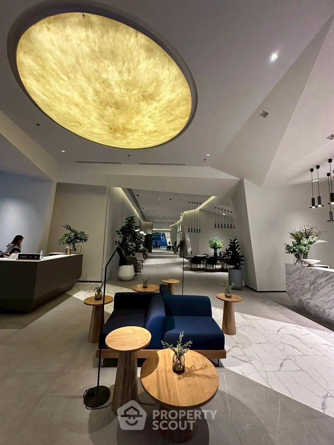 Luxurious modern lobby with elegant seating and stunning ceiling design