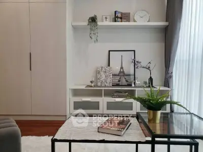 Stylish living room with modern decor and elegant shelving unit.
