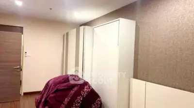 Spacious bedroom with modern wardrobe and elegant decor