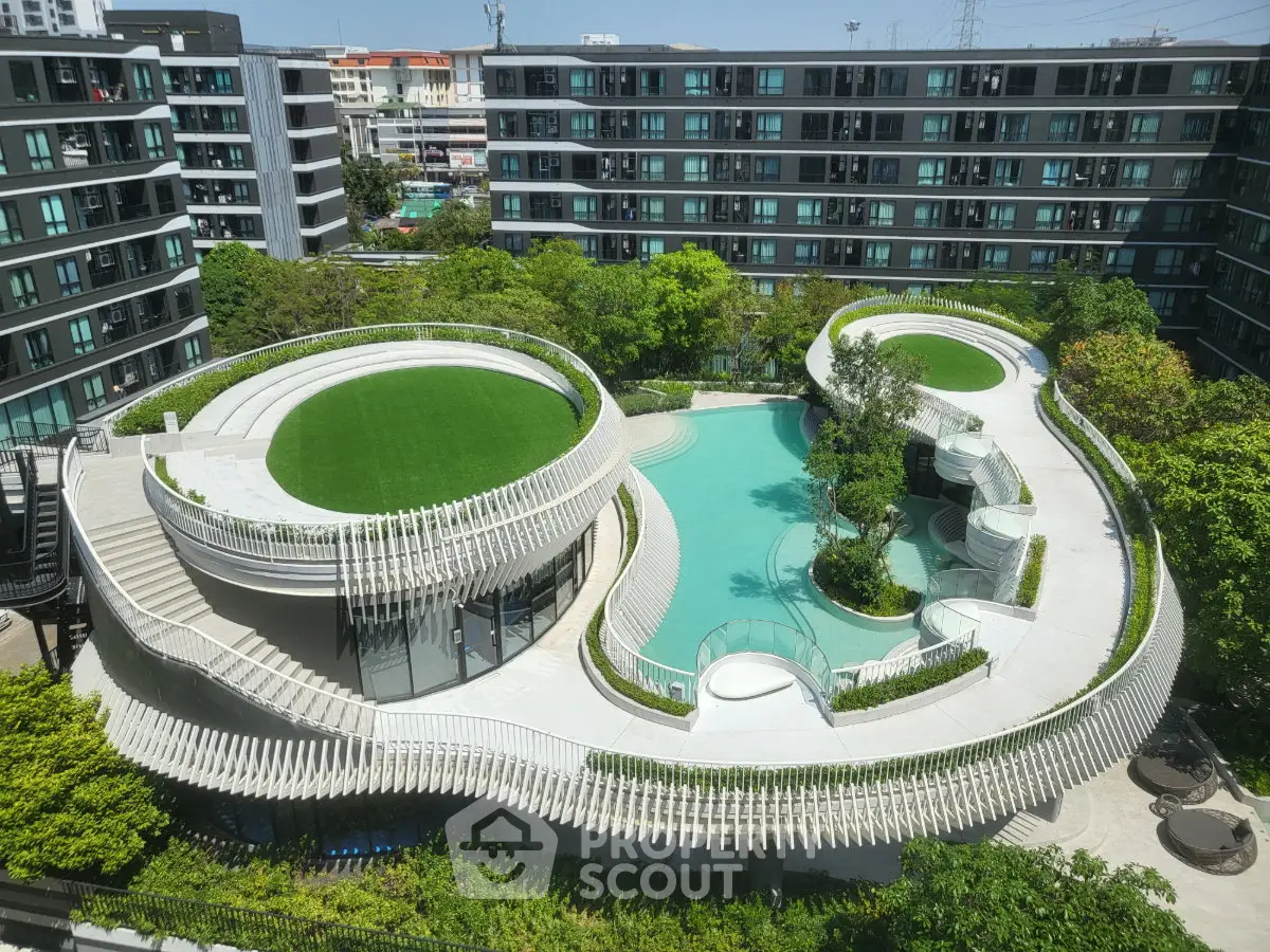 Stunning modern apartment complex with unique rooftop garden and pool design, offering luxurious urban living.