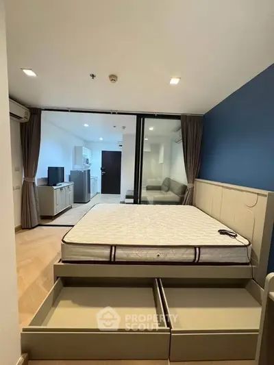 Modern bedroom with sliding glass doors and built-in storage drawers