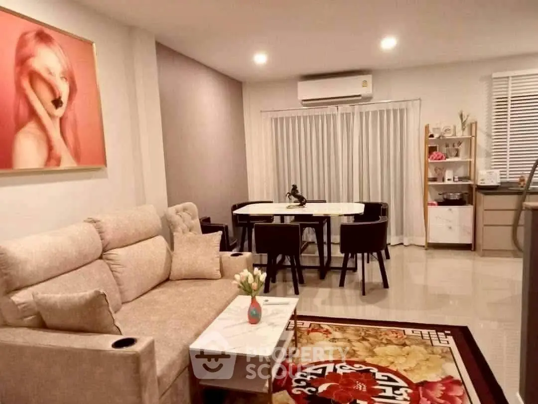 Stylish living room with modern decor and elegant dining area, perfect for entertaining guests.