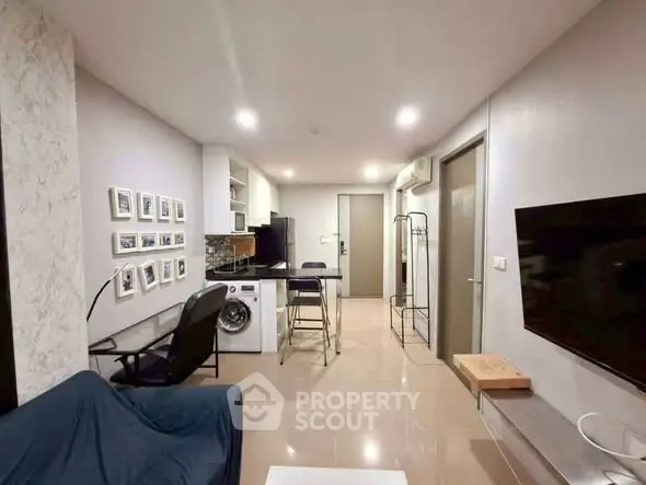 Modern living room with sleek design and integrated appliances