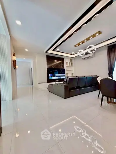 Luxurious modern living room with sleek design and elegant lighting, perfect for stylish urban living.