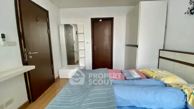 Cozy bedroom with modern decor and ample storage space