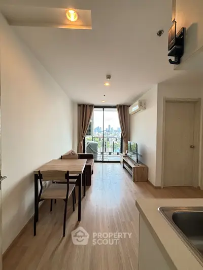 Modern living room with city view, open layout, and stylish furniture