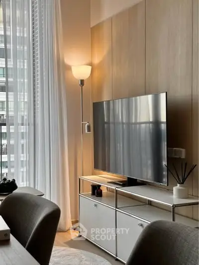 Modern living room with sleek TV setup and elegant lighting