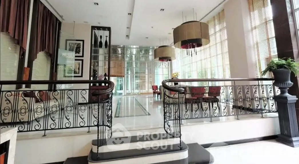 Luxurious building entrance with elegant decor and large windows