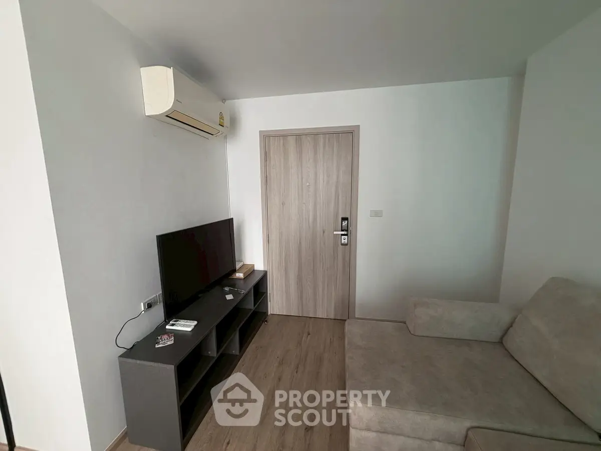 Modern living room with air conditioning and sleek furniture in a cozy apartment.
