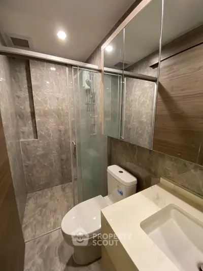 Modern bathroom with sleek design and glass shower enclosure