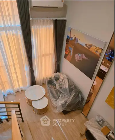 Modern loft interior with high ceilings and stylish decor