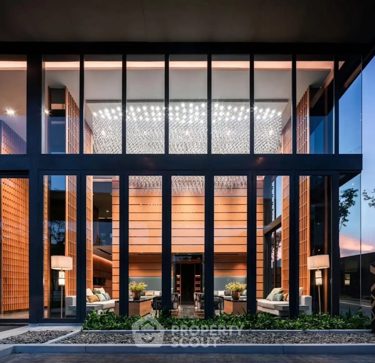 Stunning modern building facade with large glass windows and elegant lighting
