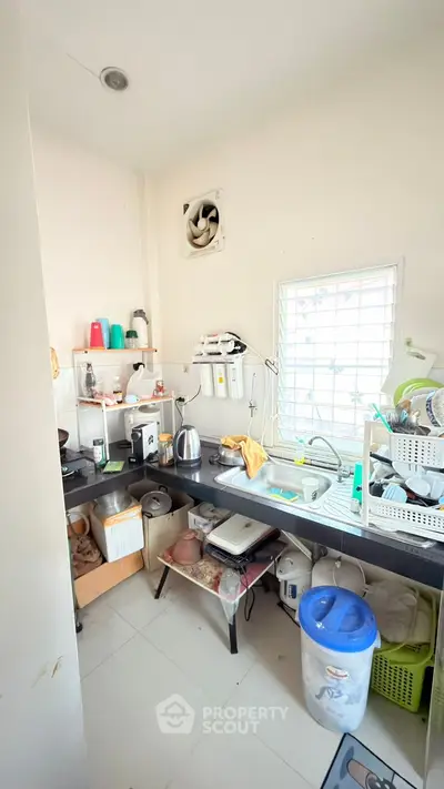 Compact kitchen with essential appliances and storage space