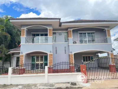 Stunning two-story house with modern design and spacious balcony in a serene neighborhood.