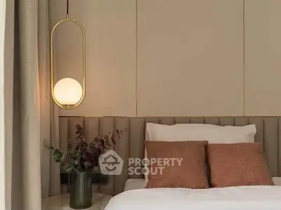Elegant bedroom with modern lighting and stylish decor, perfect for a cozy retreat.