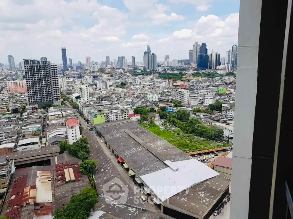 Stunning cityscape view from high-rise building showcasing urban skyline and vibrant city life.