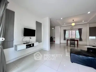 Spacious modern living room with sleek design and ample natural light