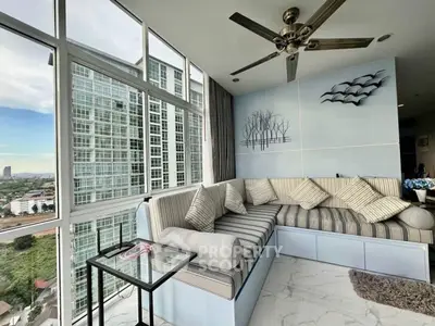 Modern living room with panoramic city view and stylish decor