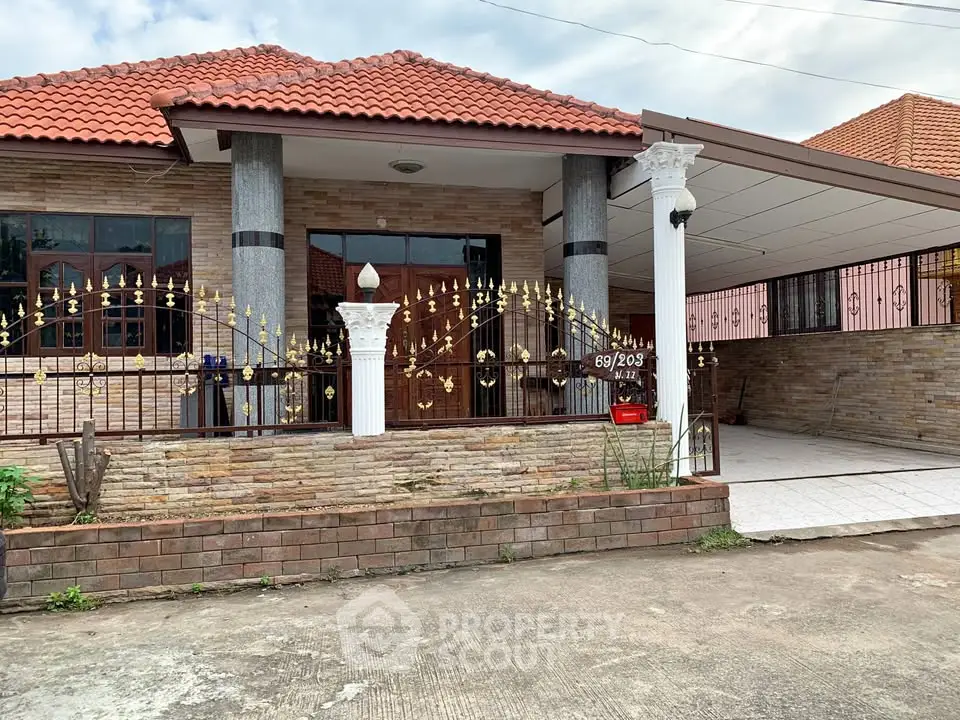 Charming single-story house with red tile roof and spacious driveway