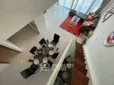 Stunning modern living room with elegant dining area and stylish decor, perfect for entertaining guests.