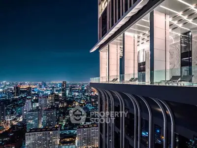 Stunning high-rise building with panoramic city views at night, featuring modern architecture and luxurious amenities.