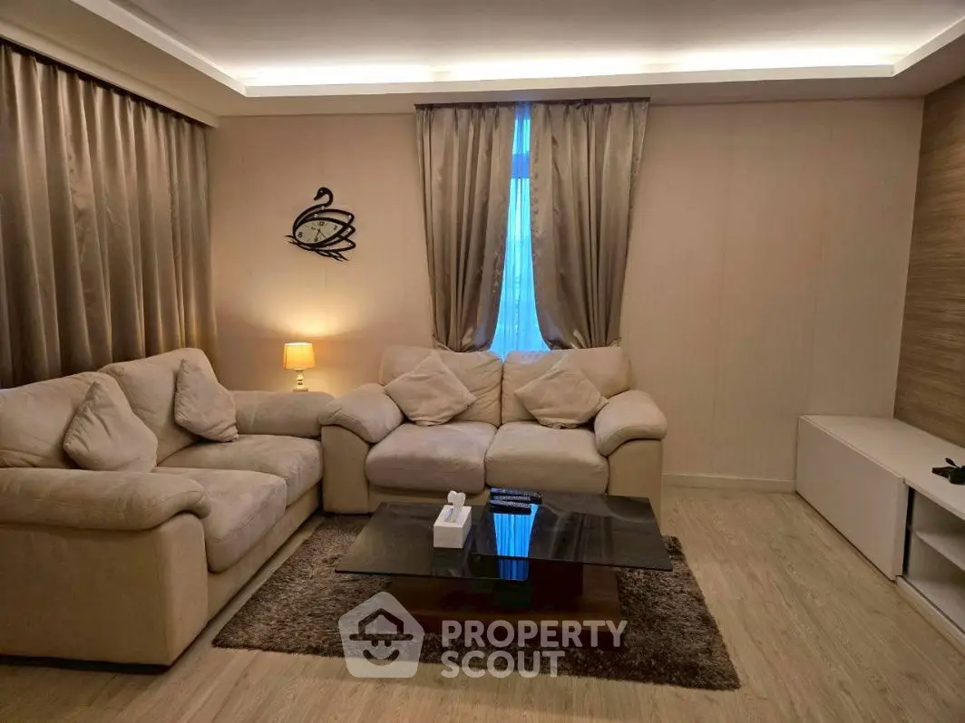 Elegant living room with cozy beige sofas and modern decor