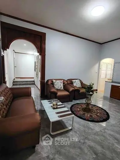 Elegant living room with brown sofas and modern decor in a stylish home
