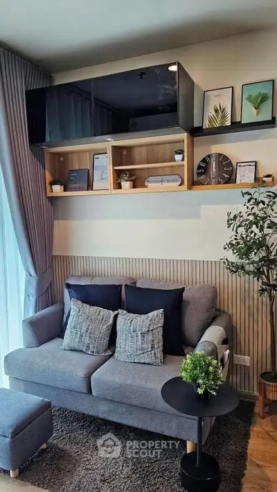 Stylish living room with modern decor, cozy sofa, and elegant shelving, perfect for urban living.