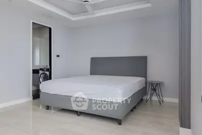 Modern bedroom with minimalist design and ensuite bathroom