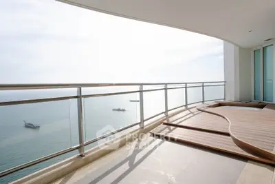 Stunning oceanfront balcony with panoramic sea views and elegant wooden flooring.