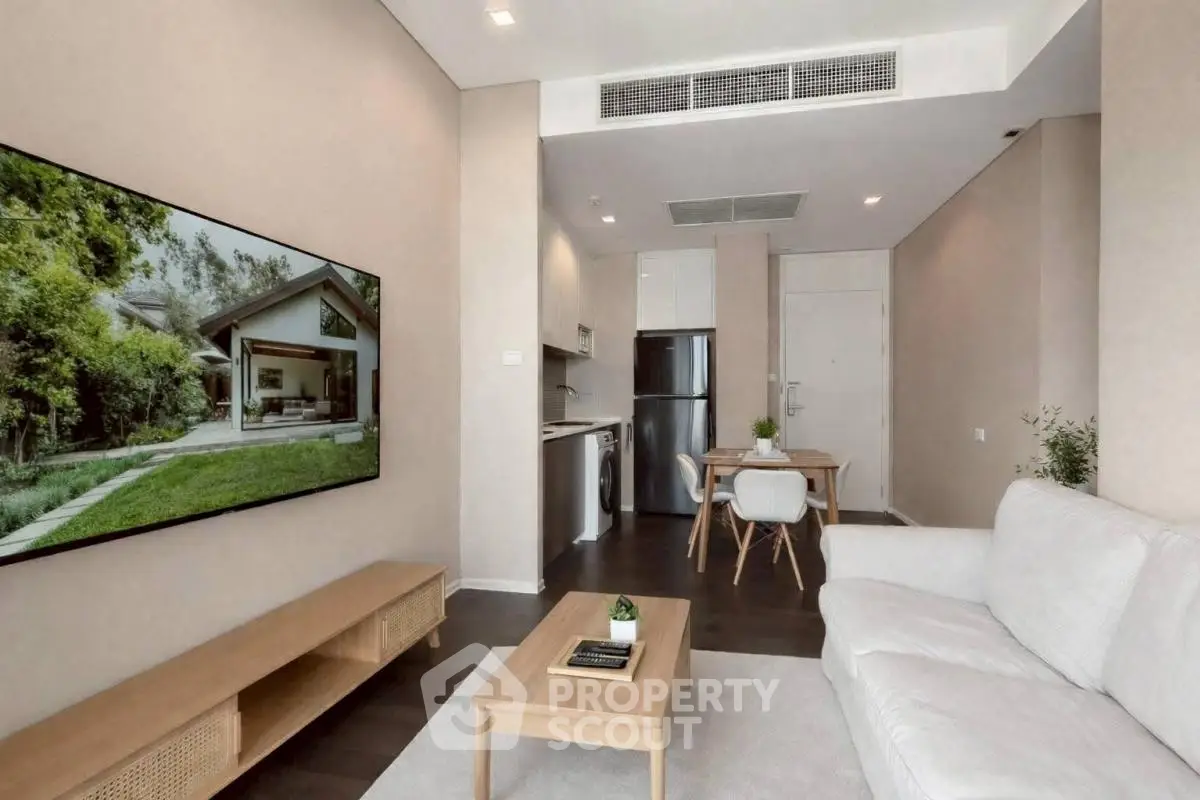 Modern living room with open kitchen and stylish decor