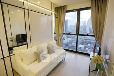 Modern living room with city view, featuring sleek design and large windows.