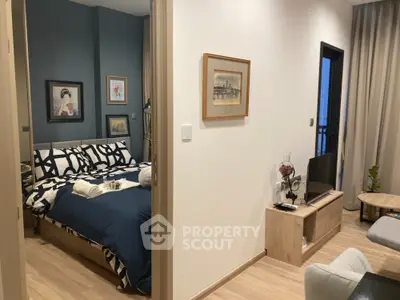 Cozy and stylish bedroom with modern furnishings, complemented by a charming living area, perfect for urban living.