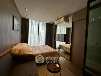 Modern bedroom with city view, featuring sleek design and cozy ambiance.