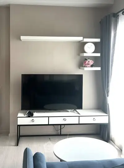 Modern living room with sleek TV unit and stylish decor