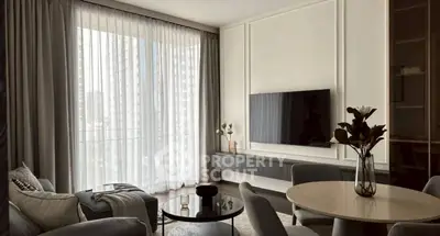 Elegant living room with modern decor and large window view