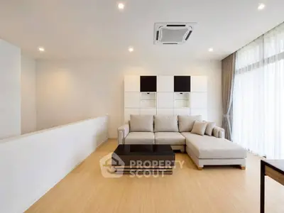 Modern living room with stylish sectional sofa and natural light