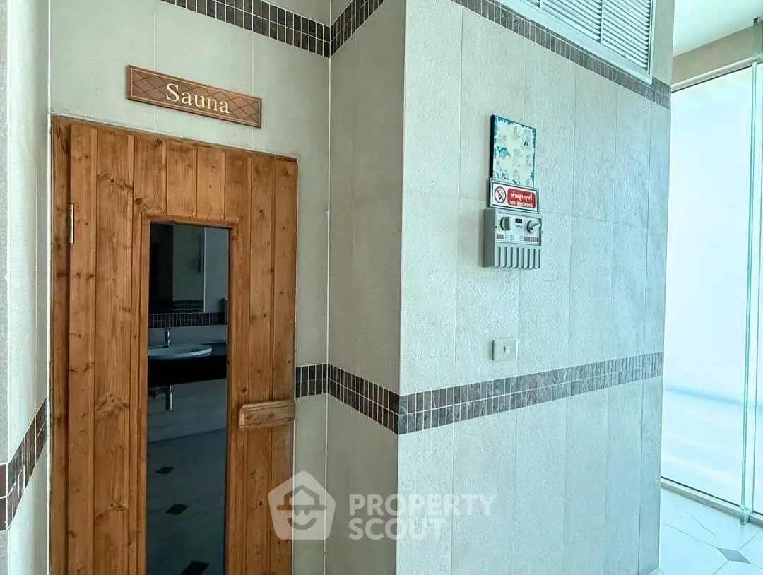 Luxurious sauna entrance in modern building with sleek design and natural wood accents.