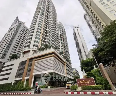 Stunning high-rise condominium with modern architecture and lush surroundings in a prime urban location.