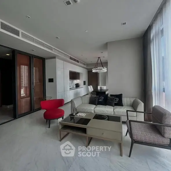 Luxurious modern living room with elegant furniture and large windows