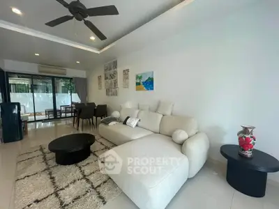 Spacious modern living room with elegant decor and open layout, perfect for relaxation and entertaining.